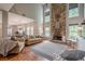 Spacious living room featuring a stone fireplace, tall ceilings, and views of the eat-in kitchen at 10865 Glenhurst Pass, Duluth, GA 30097