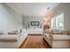 Bright living room features hardwood floors, stylish furniture, and neutral decor at 10865 Glenhurst Pass, Duluth, GA 30097
