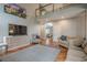 Open living space featuring hardwood floors and natural light at 10865 Glenhurst Pass, Duluth, GA 30097