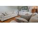 Comfortable living room features hardwood floors, neutral decor, and stylish furnishings at 10865 Glenhurst Pass, Duluth, GA 30097
