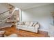 Comfortable living room with hardwood floors, neutral decor, and stylish staircase at 10865 Glenhurst Pass, Duluth, GA 30097