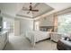 Main bedroom with a ceiling fan and windows at 10865 Glenhurst Pass, Duluth, GA 30097