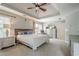 Main bedroom with a ceiling fan and windows at 10865 Glenhurst Pass, Duluth, GA 30097