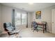 Well-lit office space with a window and wooden desk and two chairs at 10865 Glenhurst Pass, Duluth, GA 30097