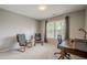 Well-lit office space with a window and wooden desk and two chairs at 10865 Glenhurst Pass, Duluth, GA 30097