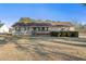 Inviting single-story home featuring a quaint front porch and well-maintained landscaping at 140 Moseley Dr, Stockbridge, GA 30281
