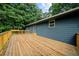 Long, wooden deck with metal guard rails runs along the back of the house at 30 Roseberry Dr, Stockbridge, GA 30281