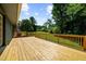 Large wooden deck perfect for entertaining with views of the expansive backyard and beautiful landscaping at 30 Roseberry Dr, Stockbridge, GA 30281