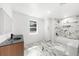 Elegant bathroom featuring marble-look tile and contemporary fixtures at 30 Roseberry Dr, Stockbridge, GA 30281