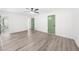 Open and bright bedroom featuring unique flooring, ceiling fan, and decorative painted doors at 30 Roseberry Dr, Stockbridge, GA 30281