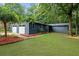 Charming single story home with attached two-car garage and lush green lawn at 30 Roseberry Dr, Stockbridge, GA 30281