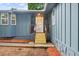 Home featuring a modern front door, stone accents, and a small porch at 30 Roseberry Dr, Stockbridge, GA 30281