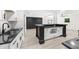 Open kitchen with island and modern appliances with lots of open space at 30 Roseberry Dr, Stockbridge, GA 30281