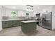 Modern kitchen with white cabinets, island, and stainless steel appliances at 30 Roseberry Dr, Stockbridge, GA 30281