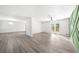 Bright, airy living room featuring light gray flooring and double doors to the outside at 30 Roseberry Dr, Stockbridge, GA 30281