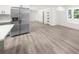 Spacious living area with a modern kitchen featuring stainless steel appliances at 30 Roseberry Dr, Stockbridge, GA 30281