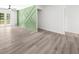 Open living room with an decorative accent wall and doors to the outdoor deck and living space at 30 Roseberry Dr, Stockbridge, GA 30281