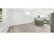 Open-concept living space with hardwood floors and a view of the kitchen at 30 Roseberry Dr, Stockbridge, GA 30281
