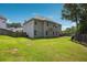 Spacious backyard with lush lawn and wooden privacy fence offering a great outdoor area at 3796 Village Crossing Ln, Ellenwood, GA 30294