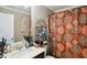 Functional bathroom with a single sink vanity and decorative shower curtain at 3796 Village Crossing Ln, Ellenwood, GA 30294