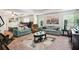 Spacious bedroom offering a comfortable seating area and various furniture pieces at 3796 Village Crossing Ln, Ellenwood, GA 30294
