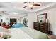 Spacious bedroom with tray ceilings and a sitting area with a large dresser at 3796 Village Crossing Ln, Ellenwood, GA 30294