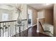 Elegant hallway with decorative chandelier and access to the upper level at 3796 Village Crossing Ln, Ellenwood, GA 30294