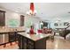 Open kitchen layout with granite countertops and stainless steel appliances at 3796 Village Crossing Ln, Ellenwood, GA 30294
