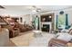 Spacious living room with a fireplace, large rug, and comfortable seating at 3796 Village Crossing Ln, Ellenwood, GA 30294