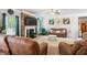 Comfortable living room with a stone fireplace, flat-screen TV, and plush seating for relaxing gatherings at 3796 Village Crossing Ln, Ellenwood, GA 30294