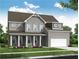 Charming two-story home features a brick facade, covered porch with columns, and an attached two-car garage at 900 Melody Ridge Ln, Buford, GA 30518