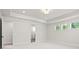 Spacious main bedroom featuring a ceiling fan, neutral carpet, and ensuite bath at 900 Melody Ridge Ln, Buford, GA 30518