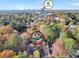 Aerial view of Druid Forest community surrounded by trees and the city skyline at 1482 N Crossing N Cir, Atlanta, GA 30329