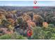 A high aerial view of the neighborhood shows mature trees and the Atlanta skyline in the distance at 1482 N Crossing N Cir, Atlanta, GA 30329