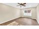 A serene bedroom features wood floors, a ceiling fan, neutral walls, and natural light at 1482 N Crossing N Cir, Atlanta, GA 30329