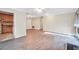 Open-concept living room featuring hardwood floors and view to kitchen and outdoor deck at 1482 N Crossing N Cir, Atlanta, GA 30329
