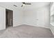 Large bedroom with ceiling fan and plush carpet at 260 Westview Sw Pl, Atlanta, GA 30314