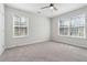 Spacious bedroom offers ample natural light and plush carpeting at 260 Westview Sw Pl, Atlanta, GA 30314