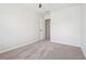 Clean bedroom with neutral walls and carpet, featuring an open closet door at 260 Westview Sw Pl, Atlanta, GA 30314