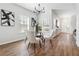 Stylish dining room with hardwood floors, a contemporary table set, and natural lighting at 260 Westview Sw Pl, Atlanta, GA 30314