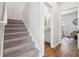 Hallway with carpeted stairs leading to stylish office and bathroom at 260 Westview Sw Pl, Atlanta, GA 30314