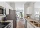 Stylish kitchen featuring stainless appliances, granite counters, and easy access to dining area at 260 Westview Sw Pl, Atlanta, GA 30314