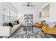 Cozy living room featuring a modern sofa, two armchairs, and plenty of natural light at 260 Westview Sw Pl, Atlanta, GA 30314