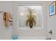 Modern bathroom featuring a soaking tub and frosted glass block window at 263 Jefferson Ave, Canton, GA 30114