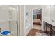 Bathroom featuring a tub with shower, vanity and view into main bedroom at 263 Jefferson Ave, Canton, GA 30114