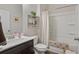 Clean bathroom with a shower-tub combo, modern vanity, and neutral decor, creating a relaxing space at 263 Jefferson Ave, Canton, GA 30114