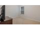 Cozy bedroom with neutral carpet, a window, and simple decor, providing a comfortable and serene atmosphere at 263 Jefferson Ave, Canton, GA 30114