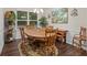 Cozy dining room with a wooden table, chairs, and decorative accents, illuminated by a chandelier at 263 Jefferson Ave, Canton, GA 30114