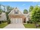 Charming home with a stone facade and well-manicured front lawn, inviting and perfect for families at 263 Jefferson Ave, Canton, GA 30114