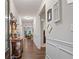 Elegant hallway features hardwood floors, decorative trim, and a view into the spacious living areas at 263 Jefferson Ave, Canton, GA 30114